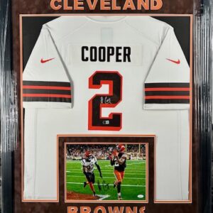 Framed Cleveland Browns jersey of Cooper with a photo below.