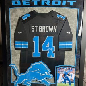 Framed Detroit Lions jersey of St. Brown with number 14.