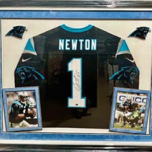 Framed Cam Newton Panthers jersey with photos.