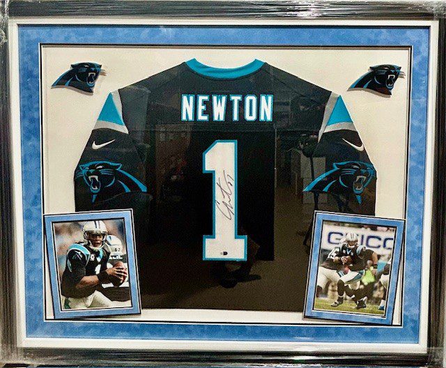 Framed Cam Newton Panthers jersey with photos.