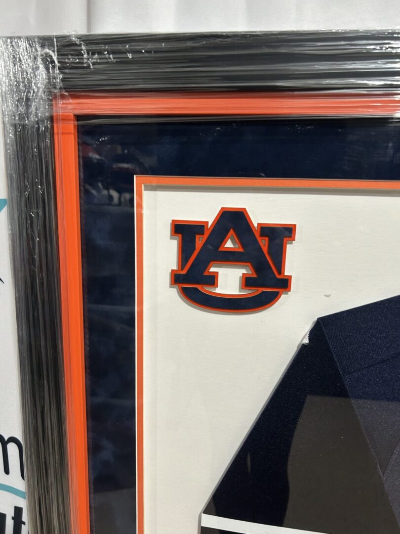 Framed Auburn University AU logo on navy mat
