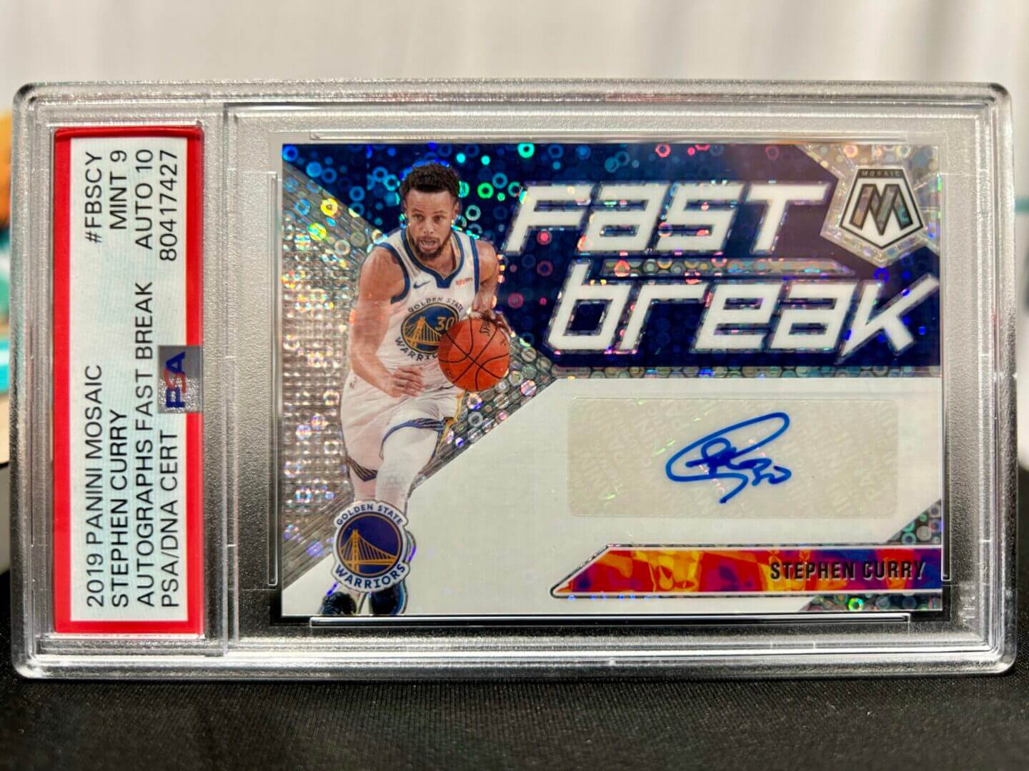 Basketball trading card in protective case.