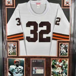 A framed football jersey number 32 with commemorative photos and plaque.