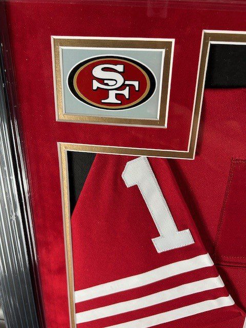 Close-up of a red sports jersey with number 1 and San Francisco 49ers logo.