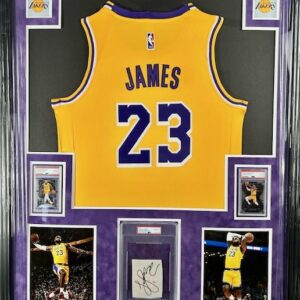 A framed LeBron James Lakers jersey number 23 with photos and memorabilia.