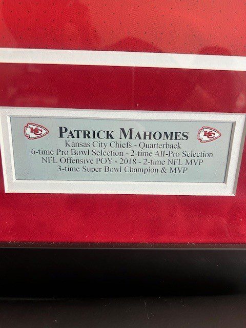 A plaque honoring Patrick Mahomes with his achievements.