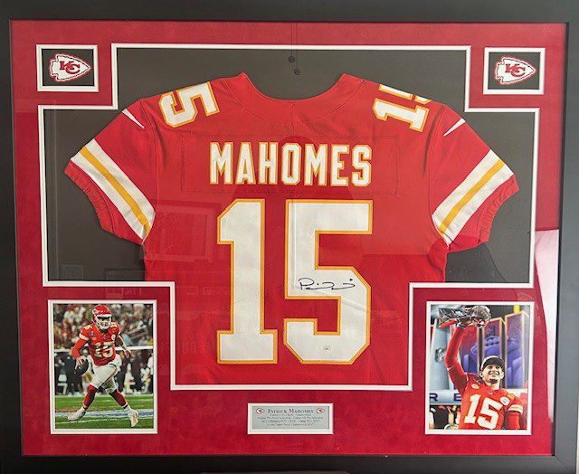 Framed Patrick Mahomes jersey with photos and memorabilia.