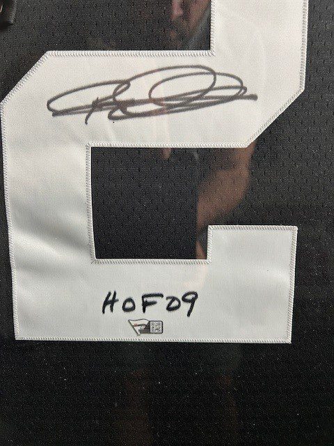 Signed jersey number with "HOF09" inscription.