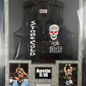 A black vest with Stone Cold theme and skull design in a display case.