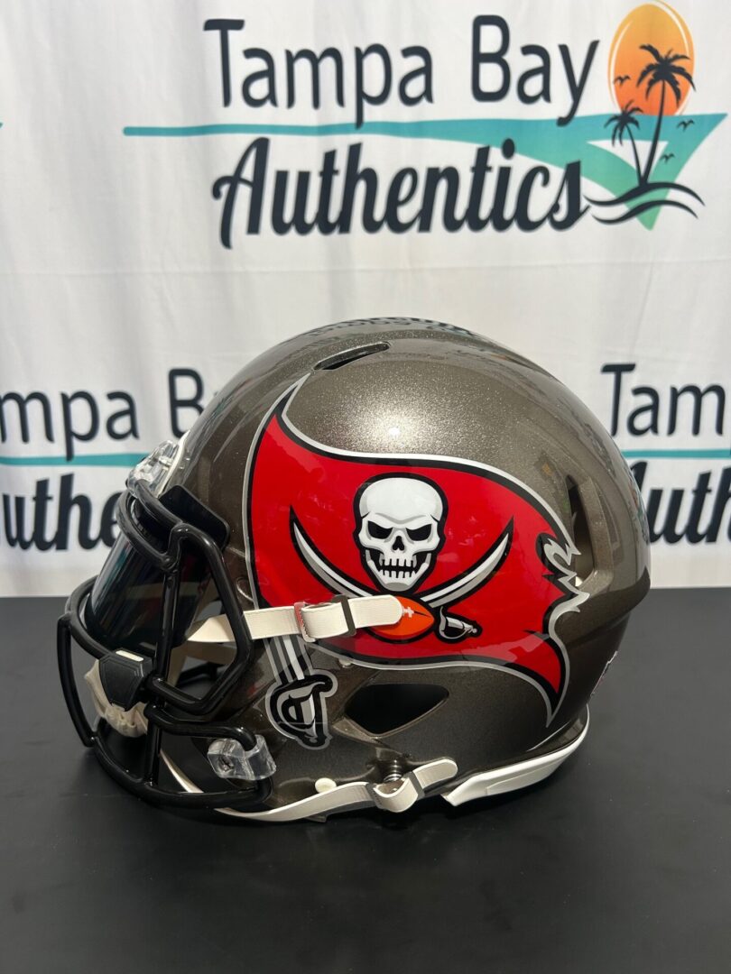A Tampa Bay Buccaneers football helmet with a skull and crossed swords logo.