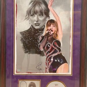 A framed display featuring a singer and memorabilia.