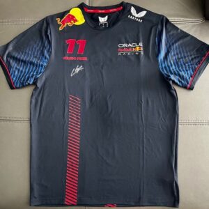 A black Red Bull racing team shirt with logos and signatures.