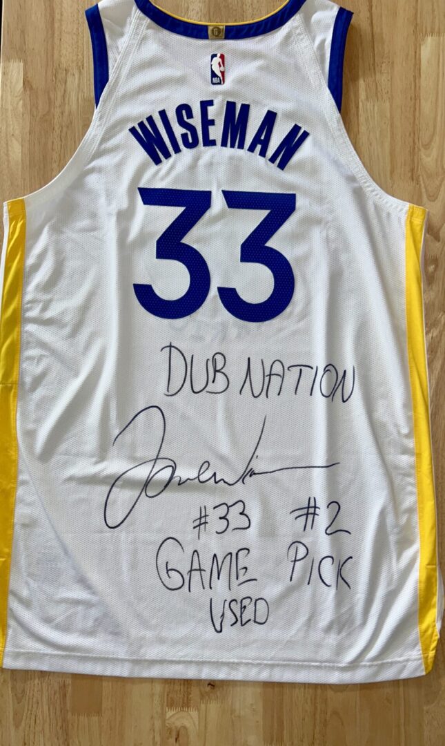 Signed basketball jersey with "Wiseman" and "33".