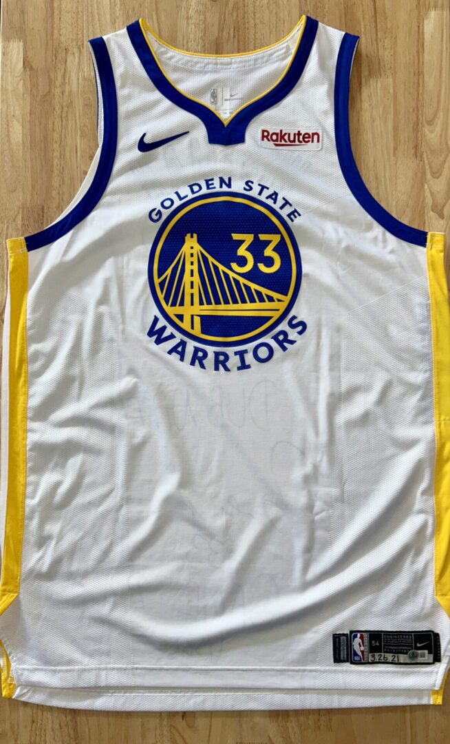 Golden State Warriors basketball jersey on display.