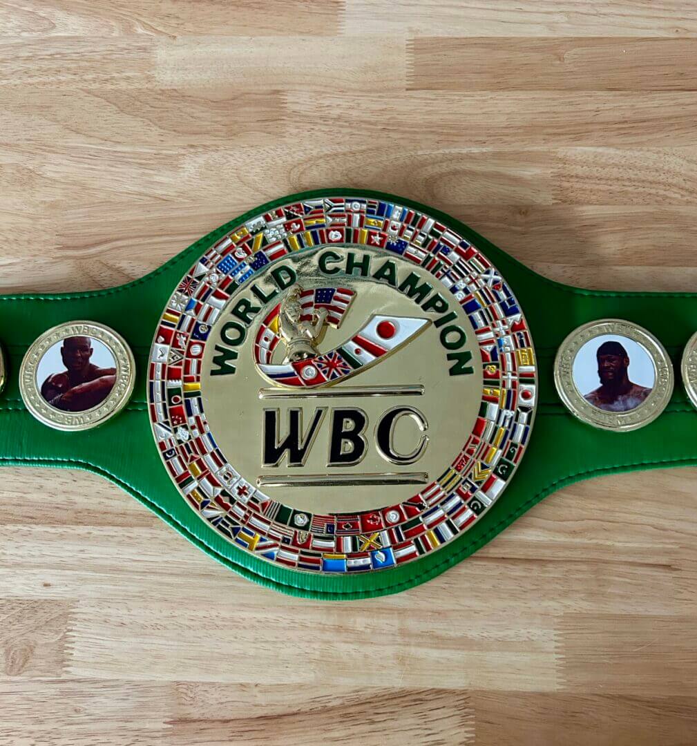 WBC World Champion boxing belt on table.