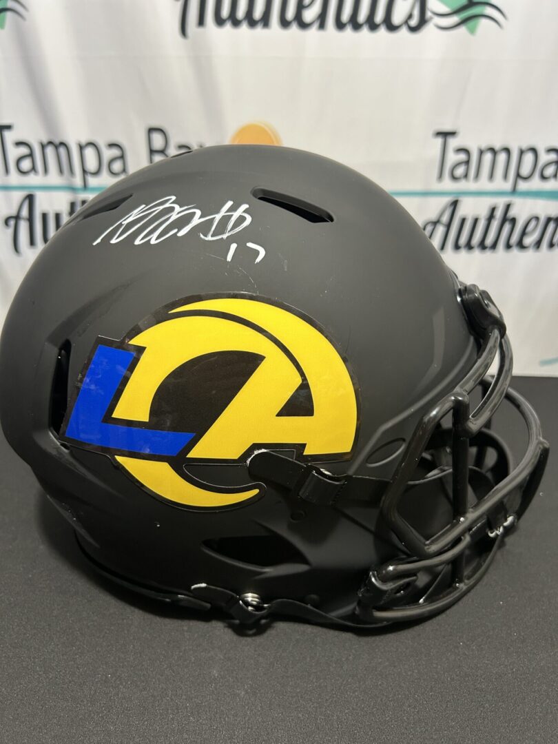 Signed football helmet with team logo.