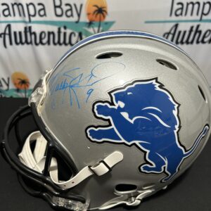 Signed Detroit Lions football helmet on display.