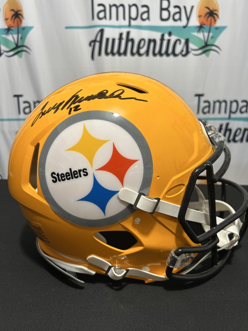 Yellow Steelers helmet with player's autograph.