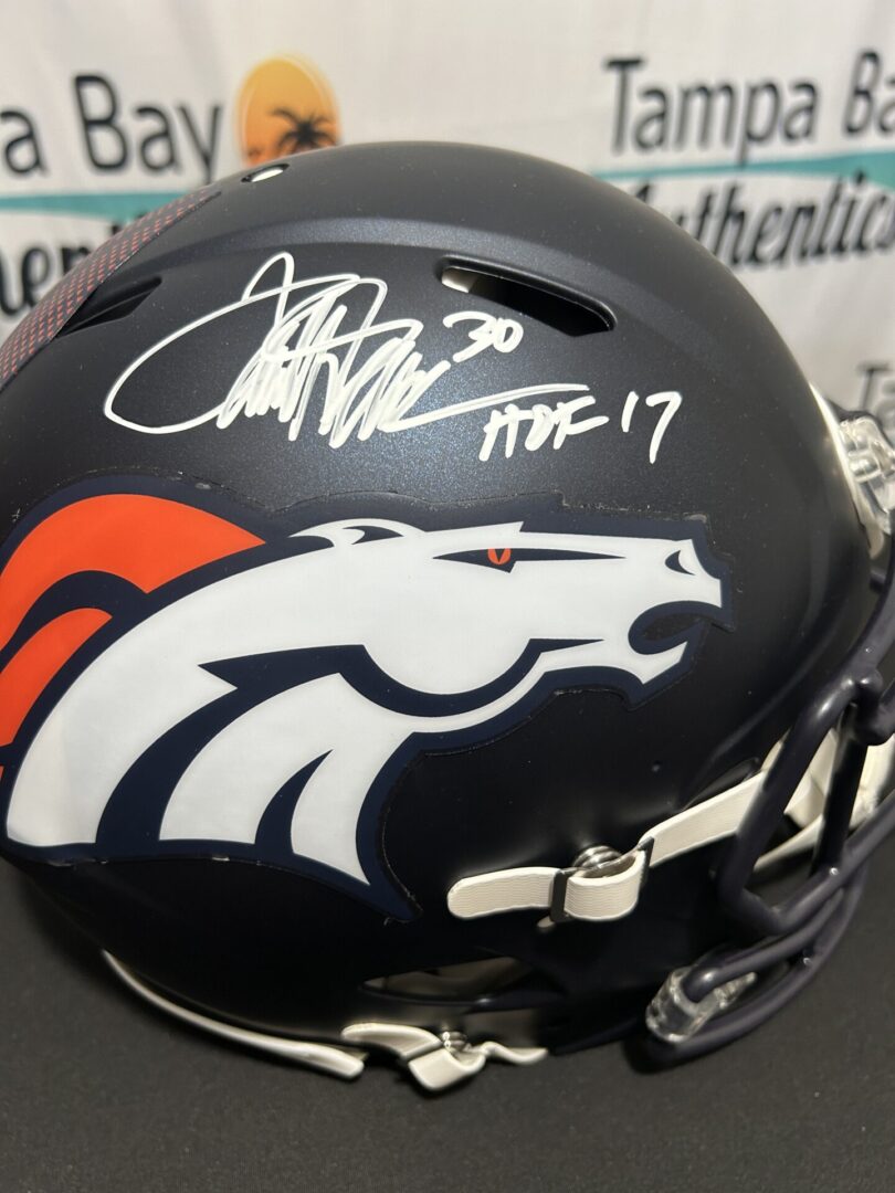 Signed Denver Broncos helmet with logo.