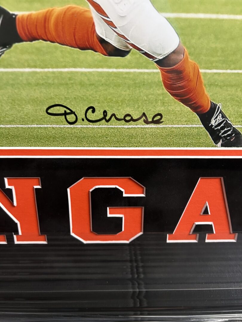 Football player autograph on field with text.