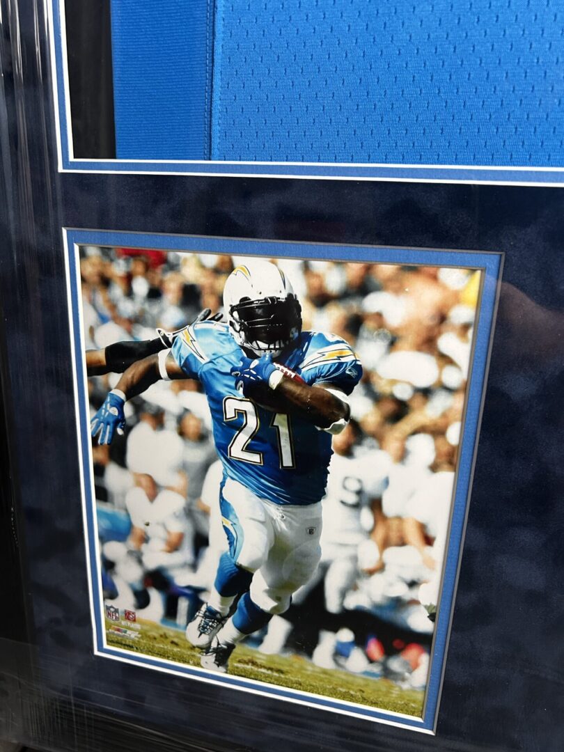 Football player running in a framed photo.