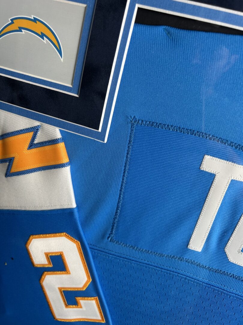 Blue football jersey with logo and number.