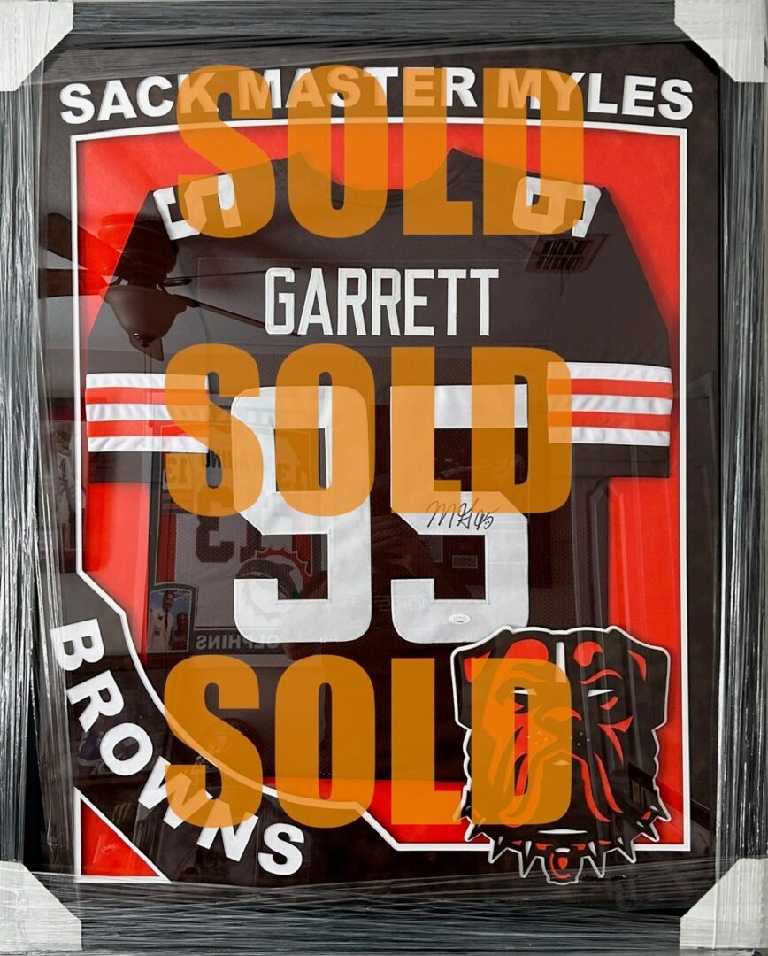 Signed Cleveland Browns No. 95 framed jersey SOLD